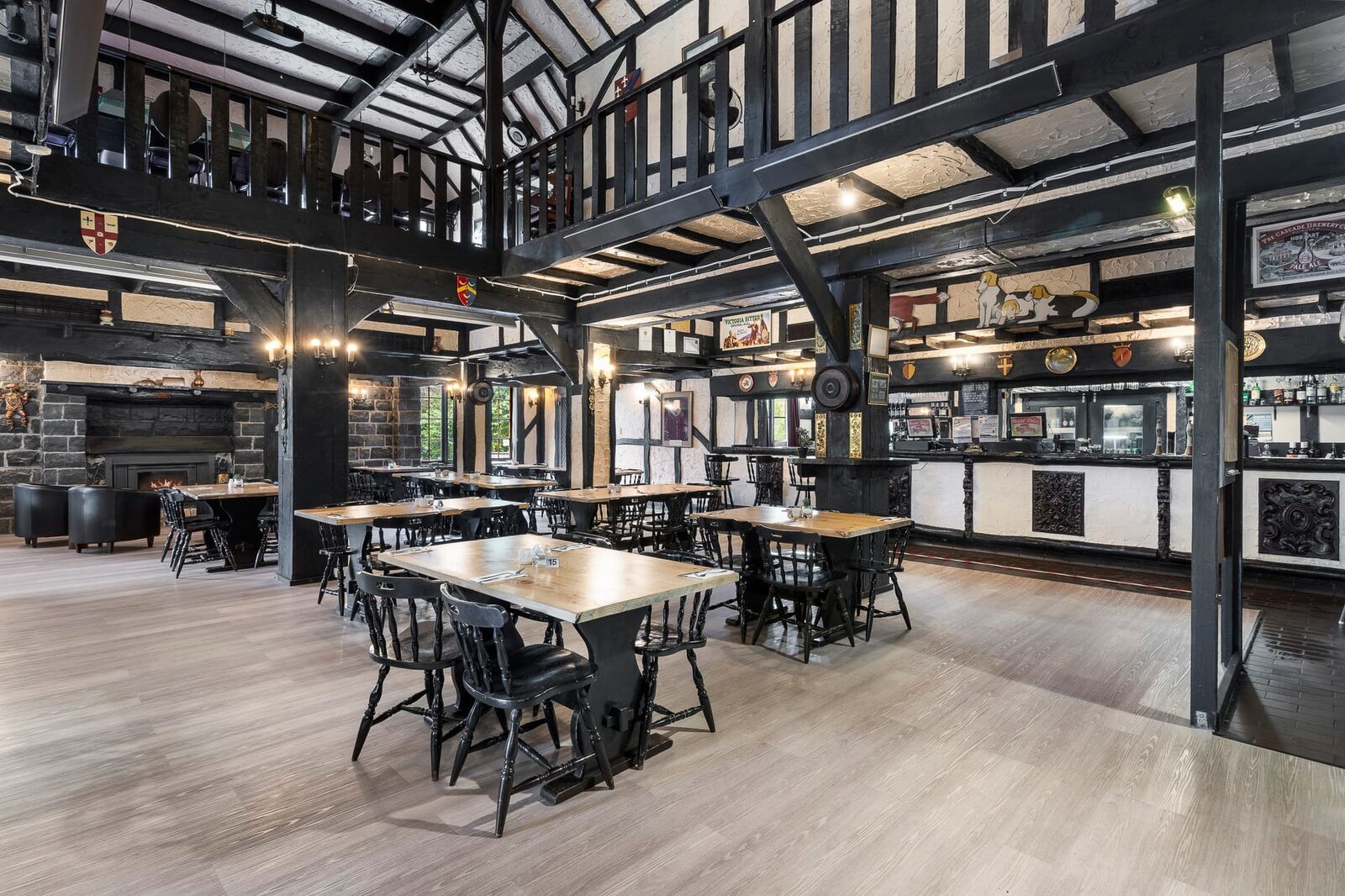 The restaurant with timber beams and stone fireplace